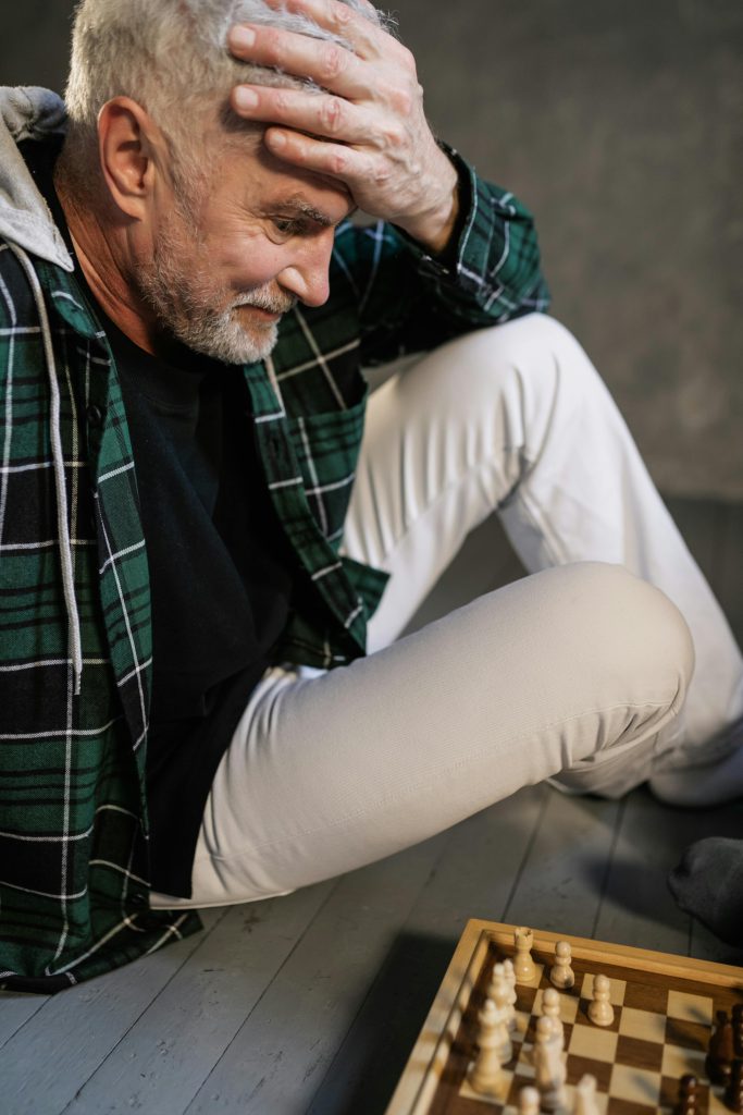 stock photo of older gentleman playing chess